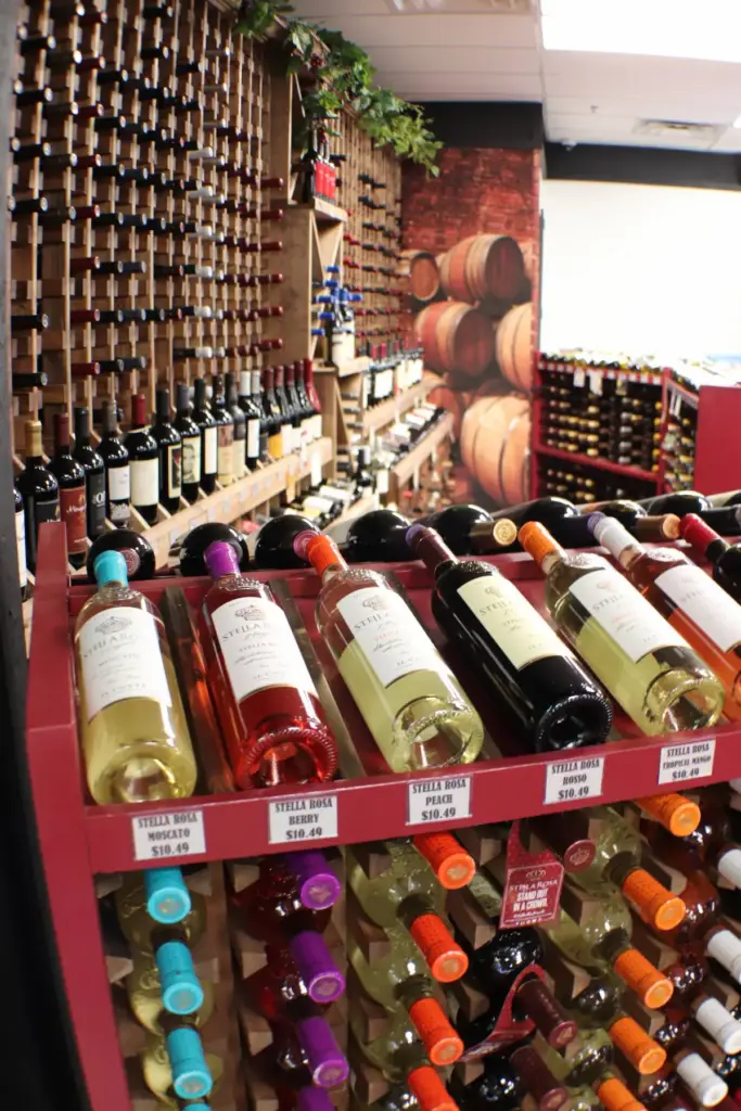 Stage Stop Liquors wine display with large collection of wine bottles.